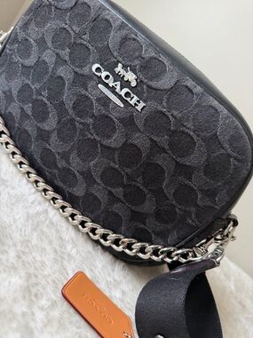 Coach Jamie Camara bag in black denim with siilver tone chain.